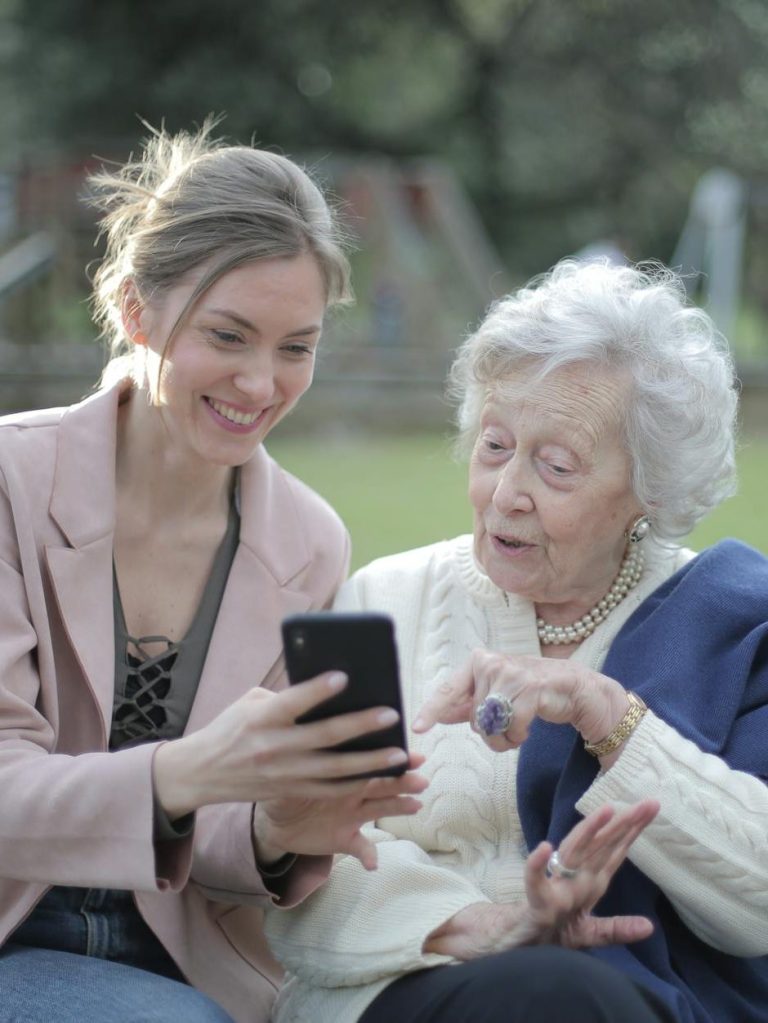 Two women looking at a phone
